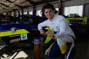 race car driver with trophy