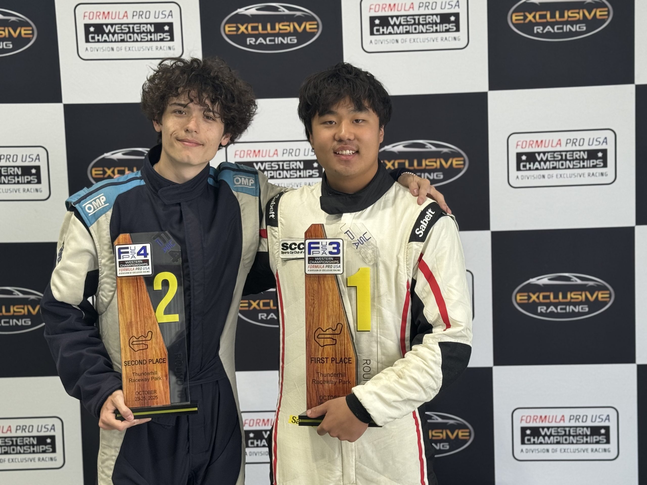 Racers with their trophies